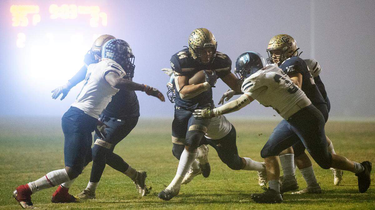 Central Catholic’s Aiden Taylor runs the ball during the CIF Division II Northern California Regional Championship game with Bullard (Fresno) at Central Catholic High School in Modesto, Calif., Dec. 3, 2021. Central Catholic won the game 44-41.