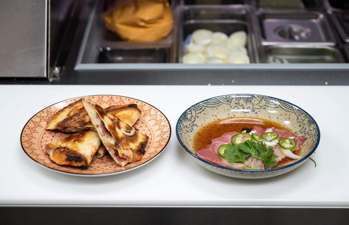 P.F.G quesadilla, left, and yellowtail sashimi dish at Lo-Fi Laboratories artisan cocktail lounge in Modesto, Calif., Wednesday, Aug. 23, 2023.