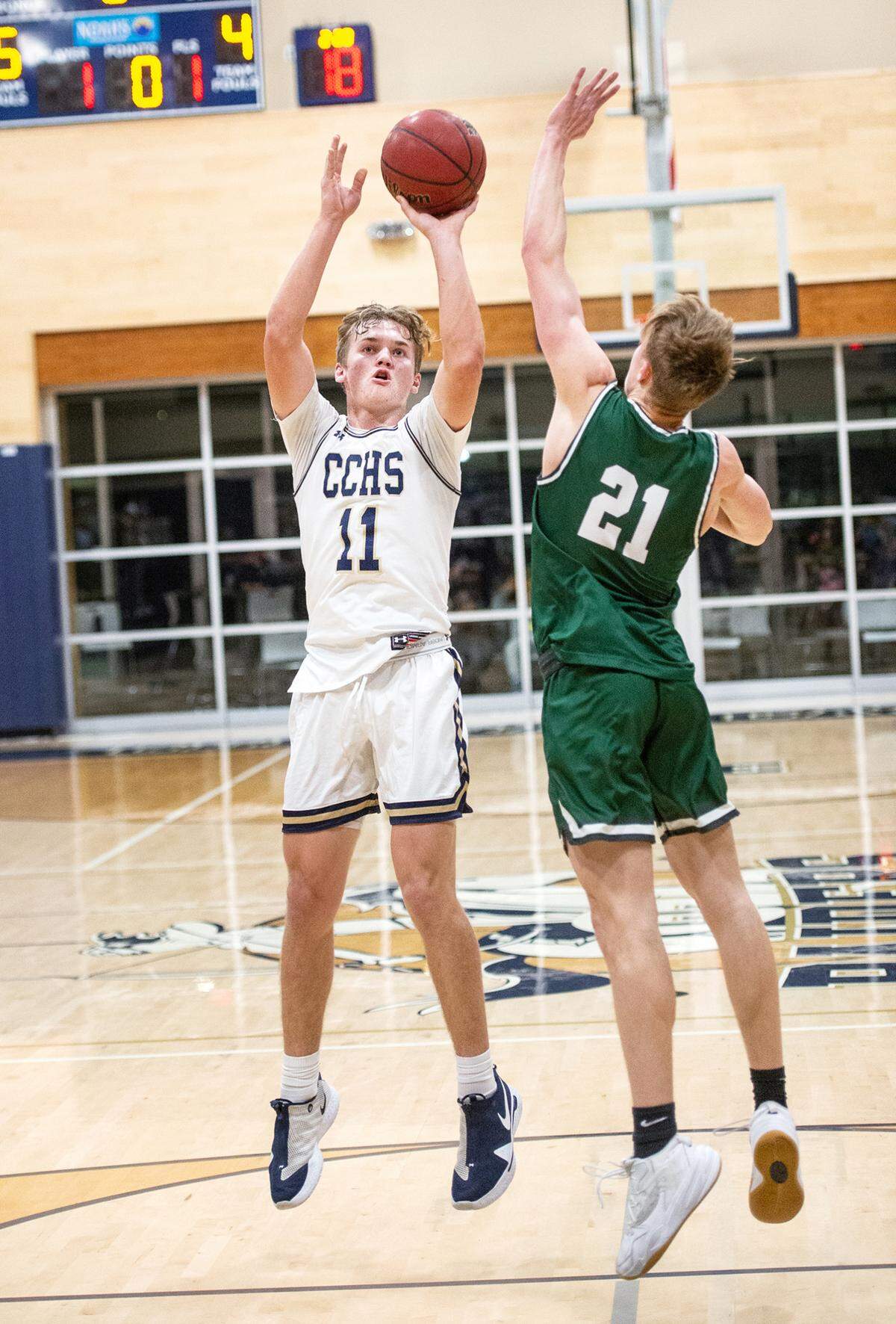 Central Catholic’s Tyler Wentworth attempts a shot as Manteca’s Ryan Inderbitzin defends during the Valley Oak League game at Central Catholic High School in Modesto, Calif., on Wednesday, Feb. 9, 2022. Manteca won the game 39-33.