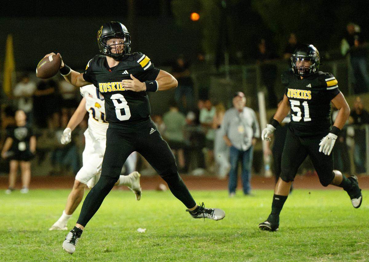 Hughson’s Robert McDaniel makes a pass during the Trans Valley League game with Escalon in Hughson, Calif., Friday, Oct. 4, 2024.