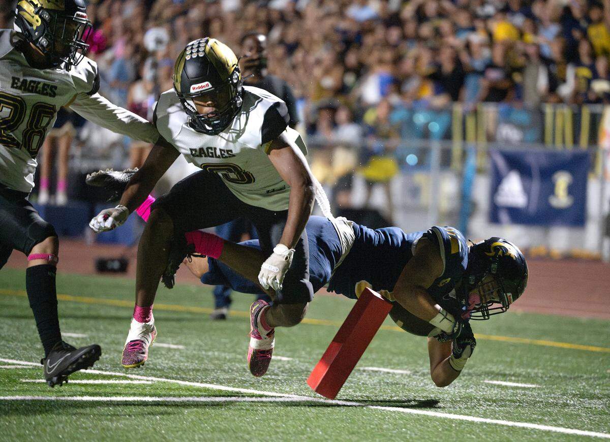 Enochs’s Marley Okoro knocks Gregori’s Landon Gutierrez near the goal line during the Central California Athletic League game at Gregori High School in Modesto, Calif., Friday, Oct. 6, 2023.
