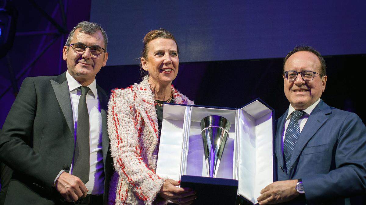 E.&J. Gallo Winery of Modesto, CA, received the Vinitaly International Award in Verona, Italy, on Saturday, April 14, 2018. At center is Gina Gallo, a third-generation leader with the company. At left is Maurizio Danese, president of Veronafiere, the host of the wine industry gathering. At right is Giovanni Mantovani, CEO of Veronafiere.