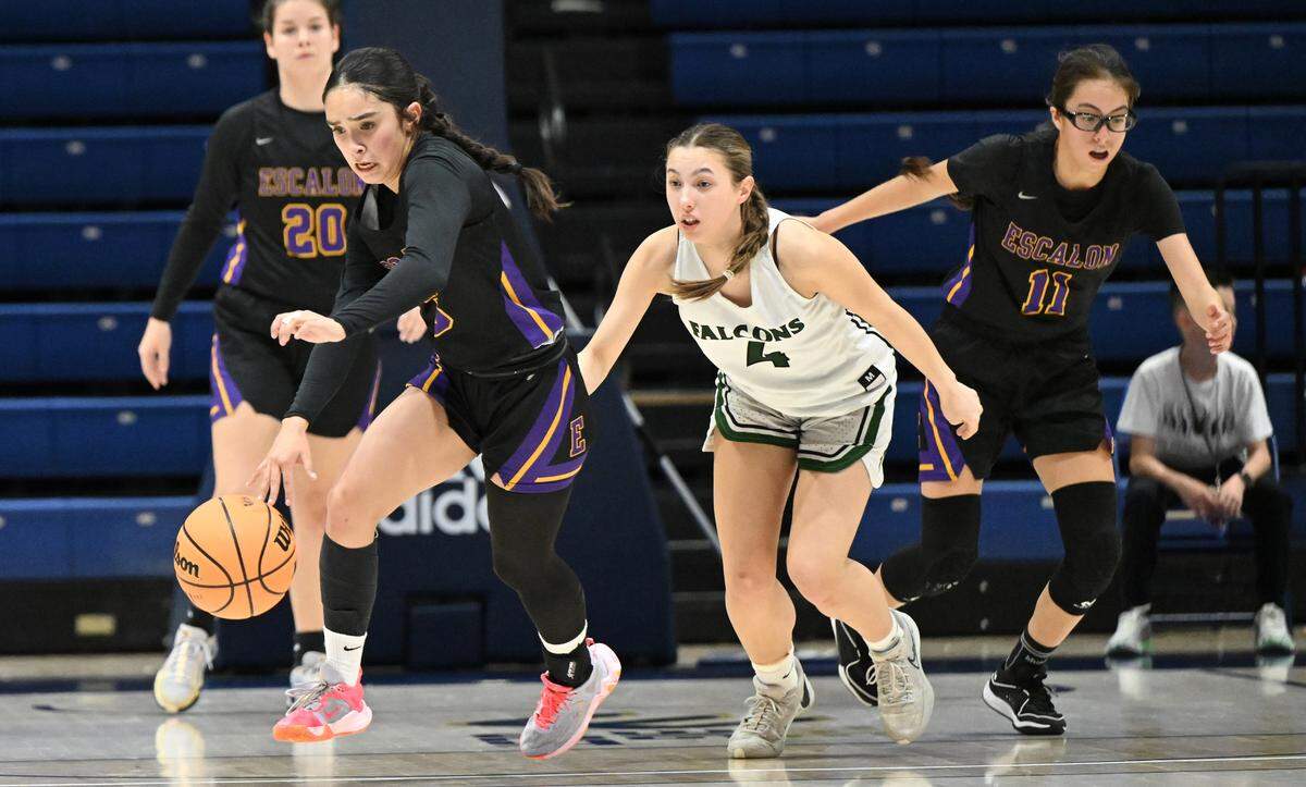 Escalon’s Madison Babasa gains control of a loose ball during the Sac-Joaquin Section Division IV championship game with Colfax at UC Davis in Davis, Calif., Friday, Feb. 23, 2024.