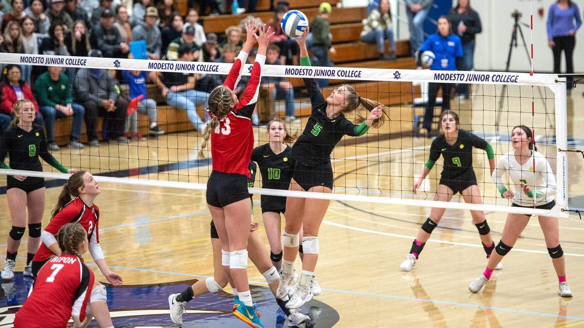 Sonora’s Paige Tipton (5) tips the ball past Ripon’s Adriana Dorn (13) during the Sac-Joaquin Section Division 4 Section final at Modesto Junior College in Modesto, Calif., Saturday, Nov. 5, 2022. Ripon won the title 3-1.