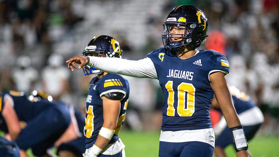 Gregori quarterback Cruz Marines signals to a teammate during the non-league game with Livermore in Salida, Calif., on Friday, Sept. 10, 2021.