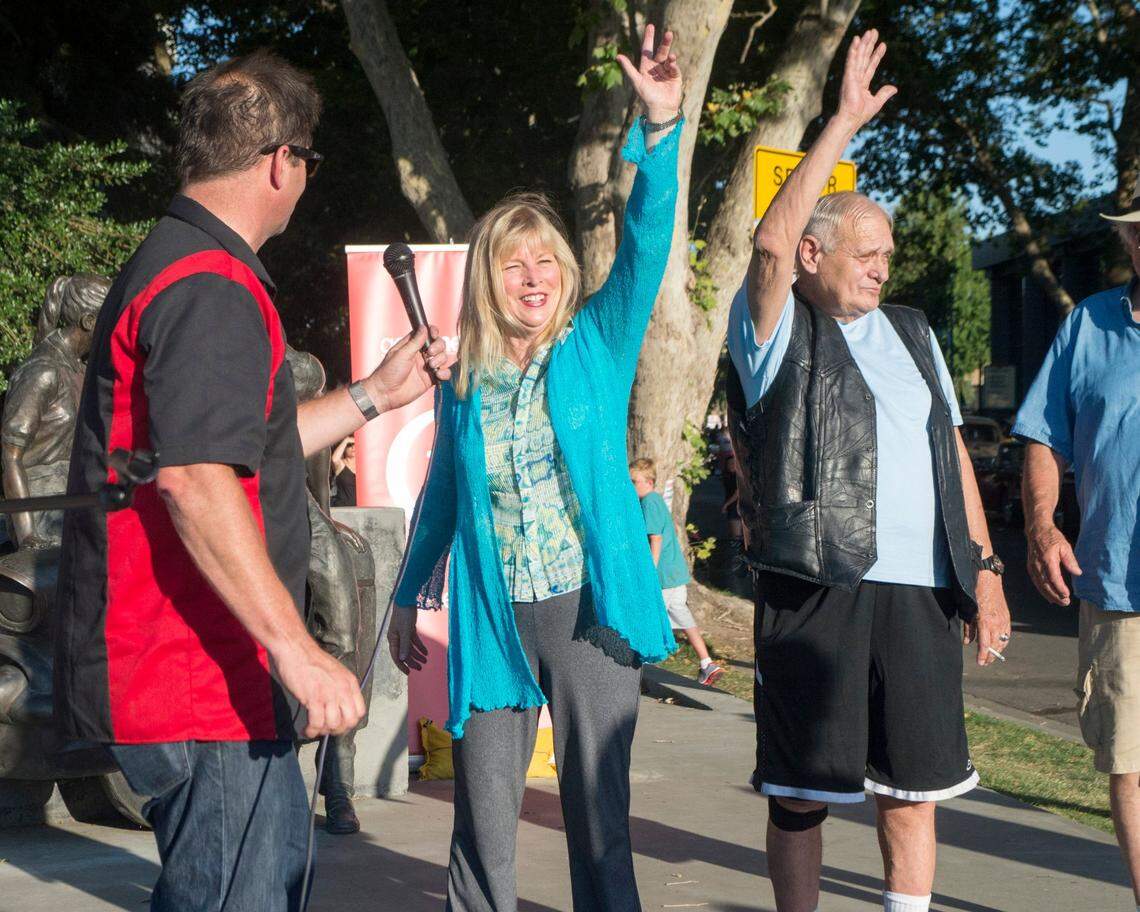 ‘American Graffiti’ actors Candy Clark and Bo Hopkins wave to fans before the Graffiti Parade in downtown Modesto on June 12, 2015.