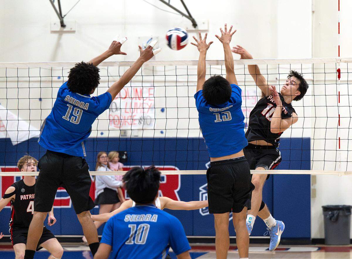 Beyer’s Luke Rossi spikes the ball past Sierra defenders during the Sac-Joaquin Section Division III semifinal playoff game at Beyer High School in Modesto, Wednesday, May 6, 2026.