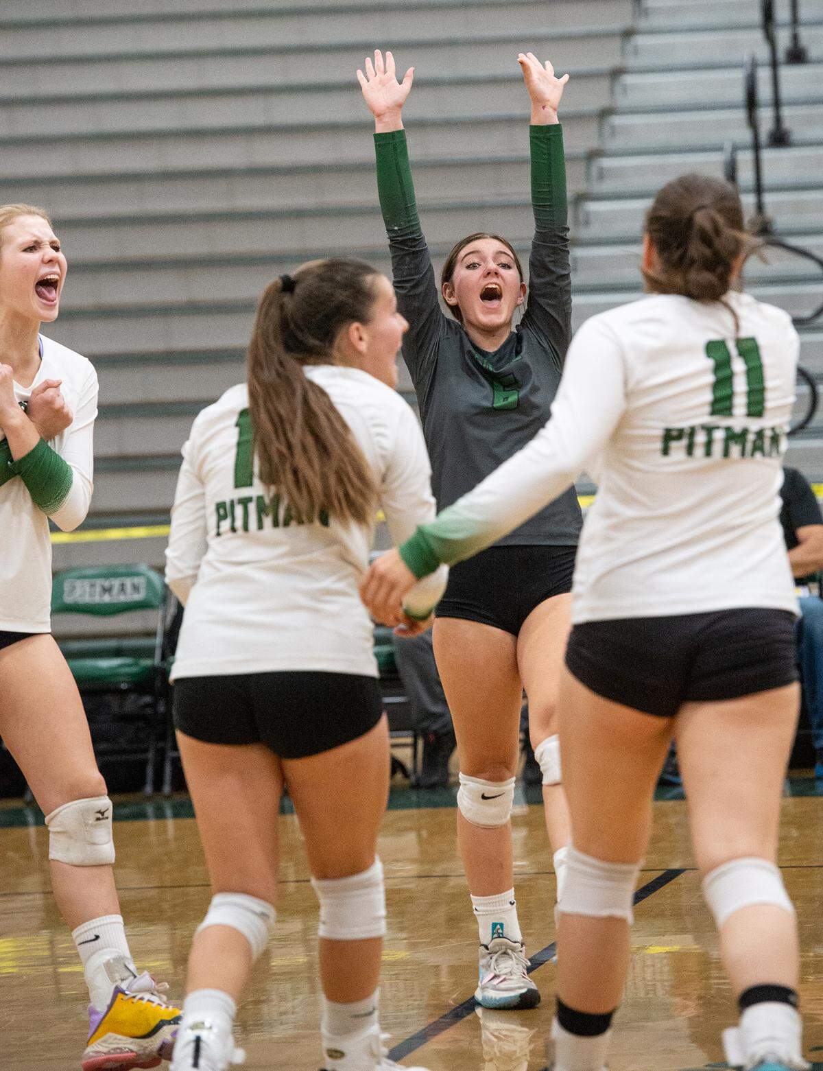 Pitman’s Reese Carmona and teammates celebrate a point during the CIF Sac-Joaquin Girls Volleyball Division I playoff match with Folsom at Pitman High School in Turlock, Calif., Thursday, Oct. 27, 2022. Pitman won the match 3-1.