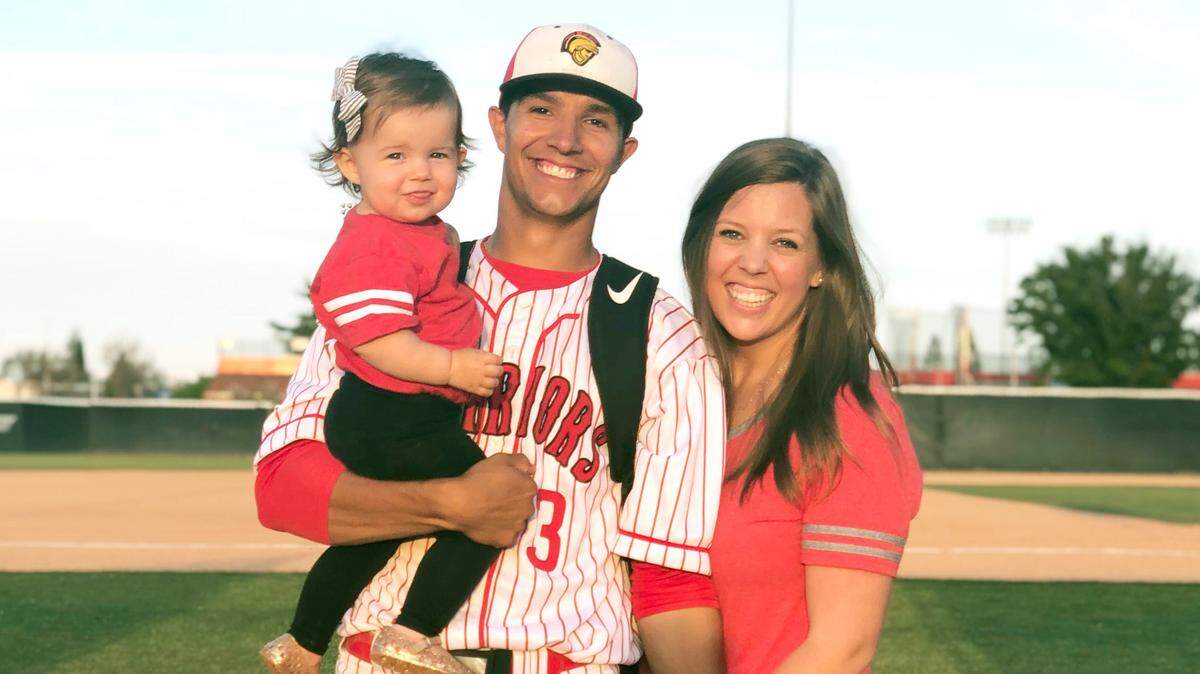 Stanislaus State baseball player Michael Wyatt with his wife, Meredith, and daughter Zella.