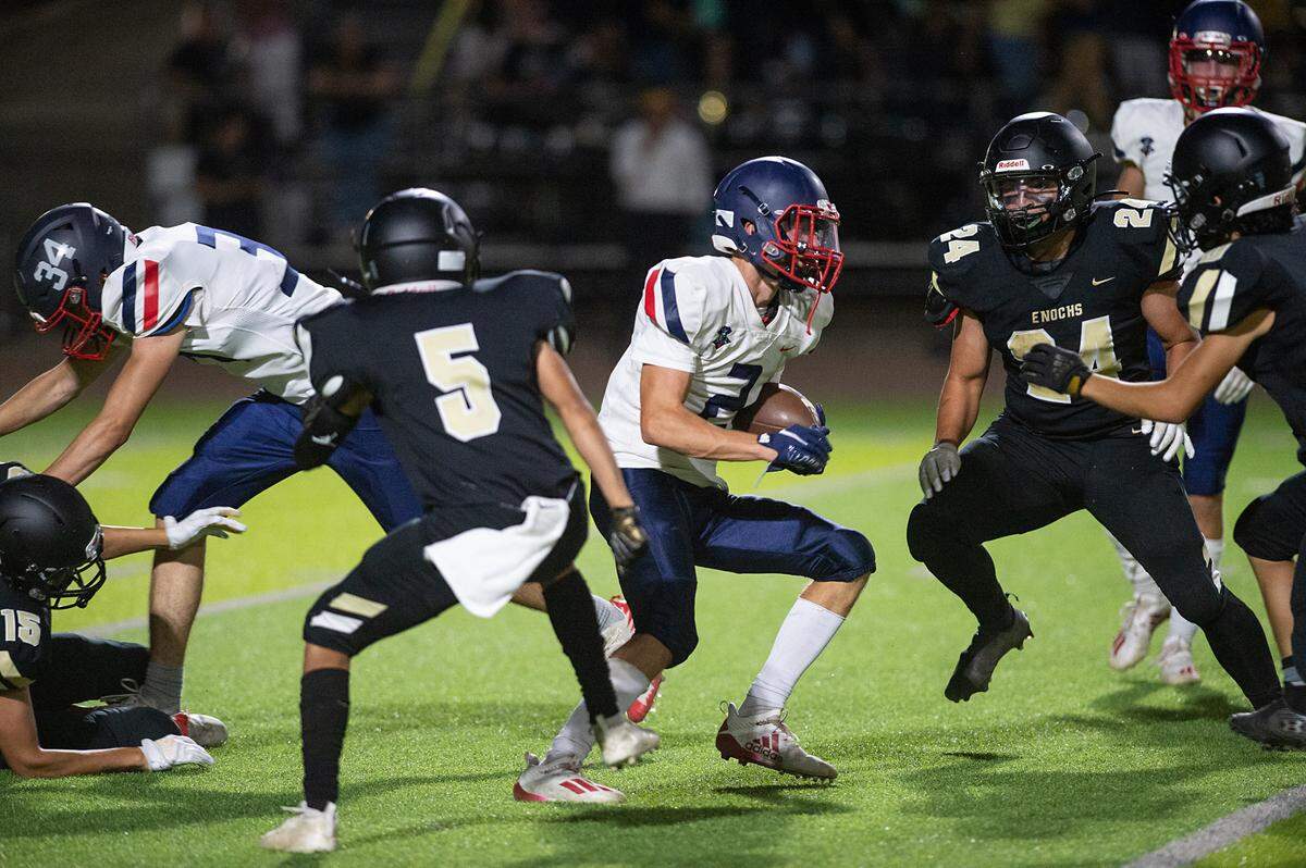 Beyer’s Brock Gross runs the ball during Friday’s game with Enochs at Downey High School in Modesto, Calif., on August 19, 2022.