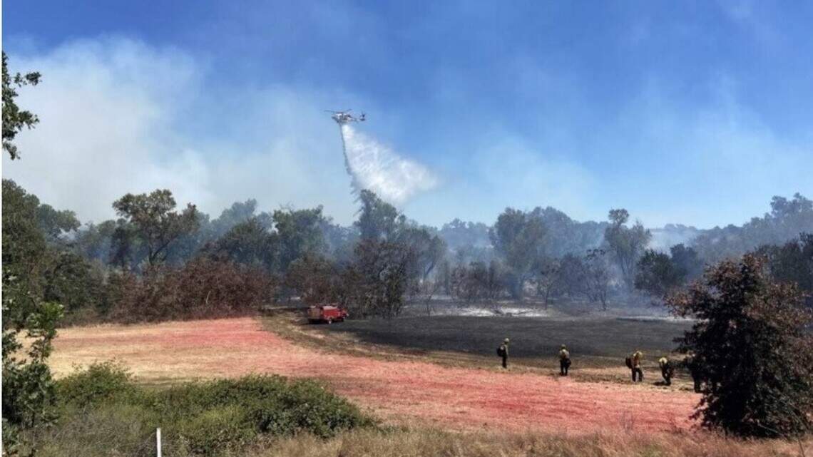 Vegetation fire burns along Stanislaus River in popular rafting area near Oakdale