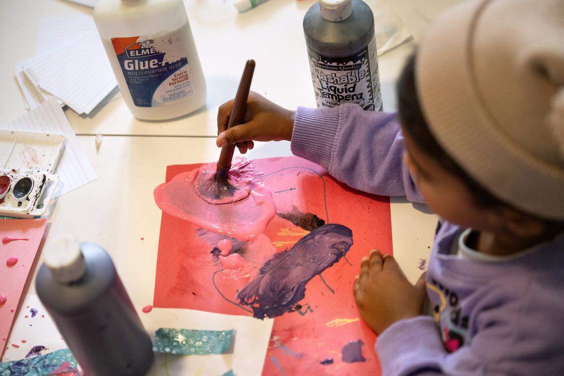 Anika Chand, 2, makes a painting at the Segura daycare in Patterson, Friday, April 24, 2026.