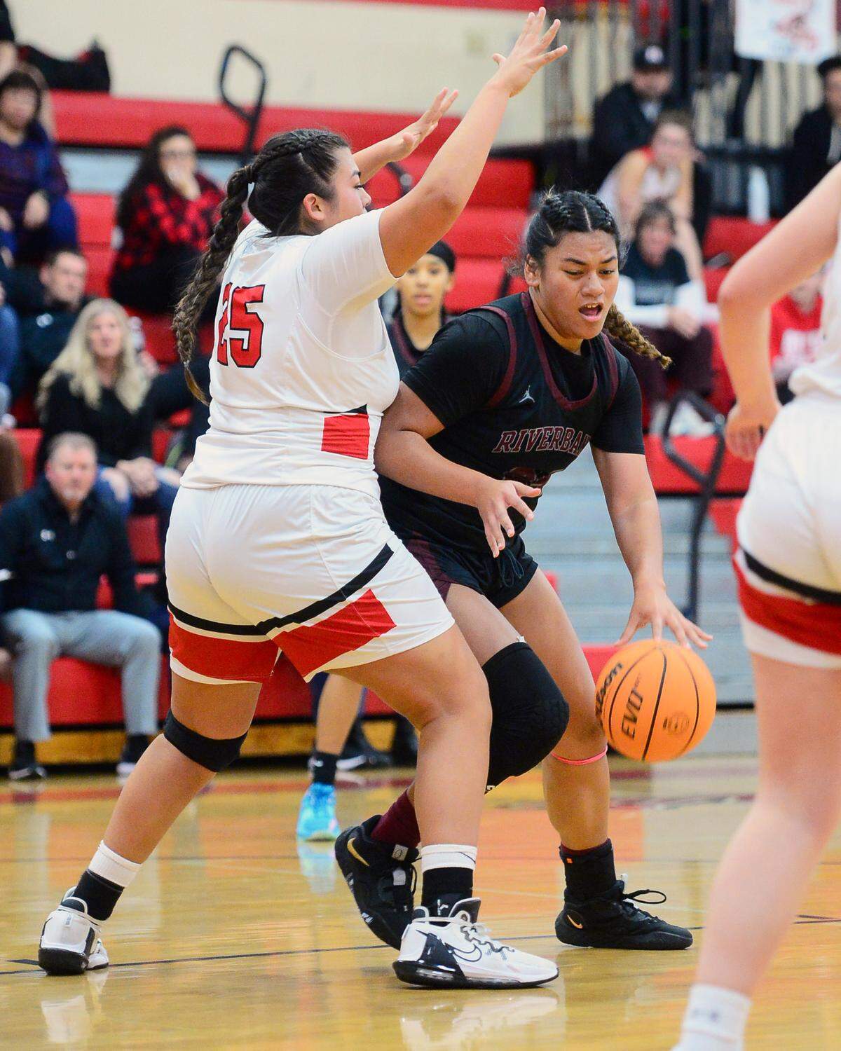 Riverbank center Rayne Tago (24) drives in the paint during a game between Ripon High School and Riverbank High School at Ripon High School in Ripon California on January 5, 2023.