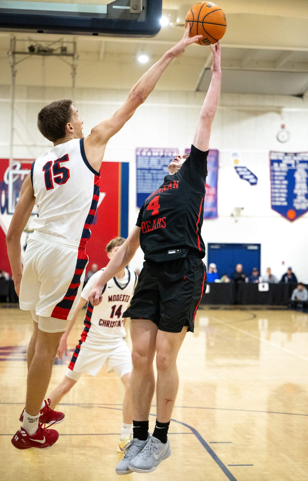 Modesto Christian’s Ry Atkins blocks the shot of Buchanan’s Conner Sheets during the Holiday Hoop Classic championship game with Modesto Christian at Modesto Christian High School in Salida, Monday, Dec. 30, 2024.
