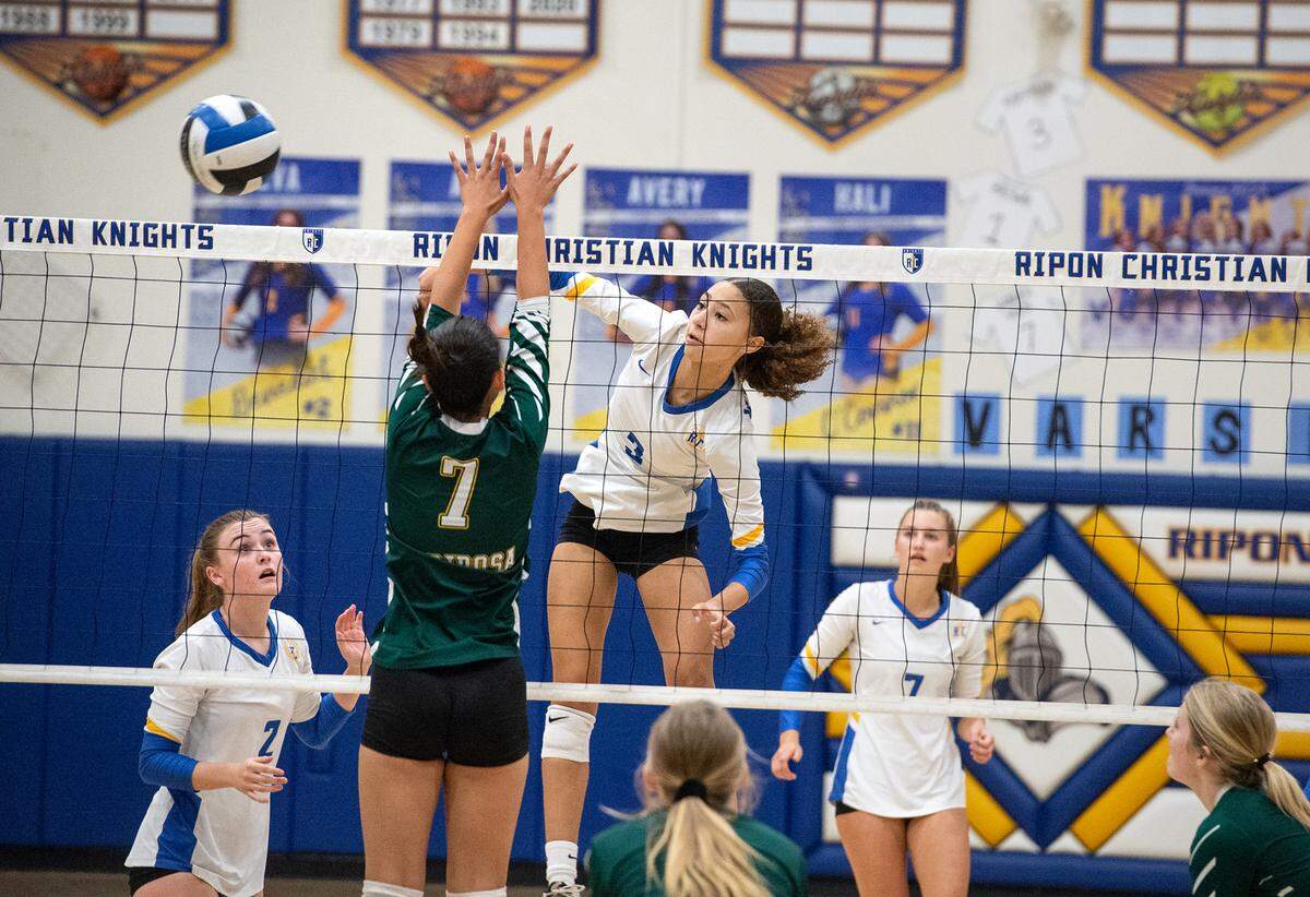Ripon Christian’s Sydney Hoffman hits the ball past Mariposa’s Marion Sberna during the Southern League game in Ripon, Calif., Thursday, Oct. 13, 2022. Ripon Christian won the match 3-0.