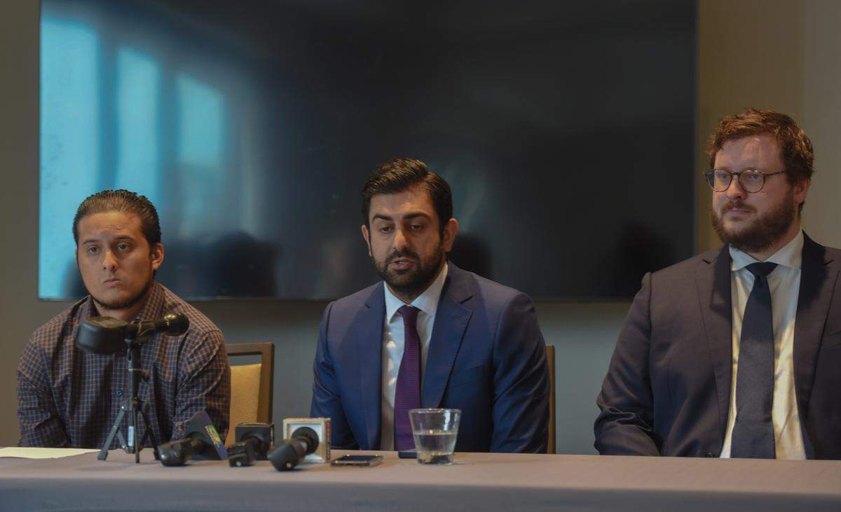 From left, Ronaldo Hernandez, attorney Neil Gehlawat and attorney Peter Reagan speak during a press conference Wednesday in Sacramento announcing a government claim against the Stanislaus County Sheriff’s Office for alleged excessive force.