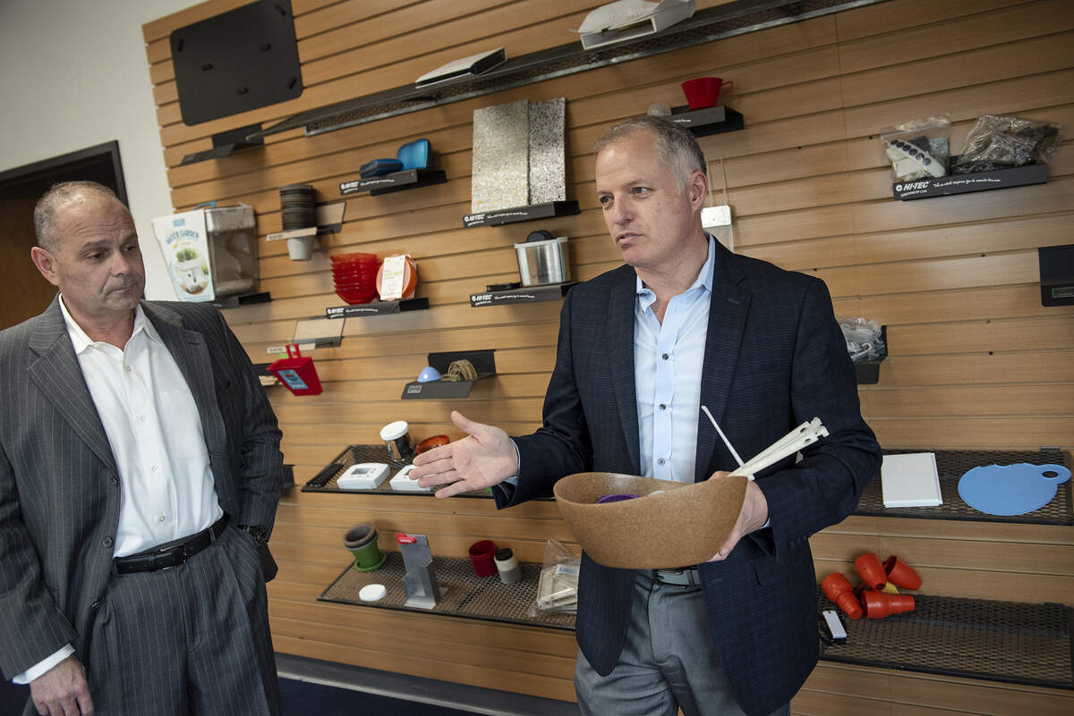JATCO Incorporated President Steven Jones, right, shows some of the products that will be produced at their new manufacturing plant in Modesto, Calif., Thursday, Feb. 28, 2019. Sales manager Steven Ames looks on.