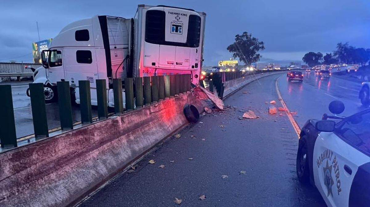California Highway Patrol officers respond to a jackknifed semi-truck on Highway 99 near Kansas Avenue in Modesto on Monday, Jan. 22, 2024.
