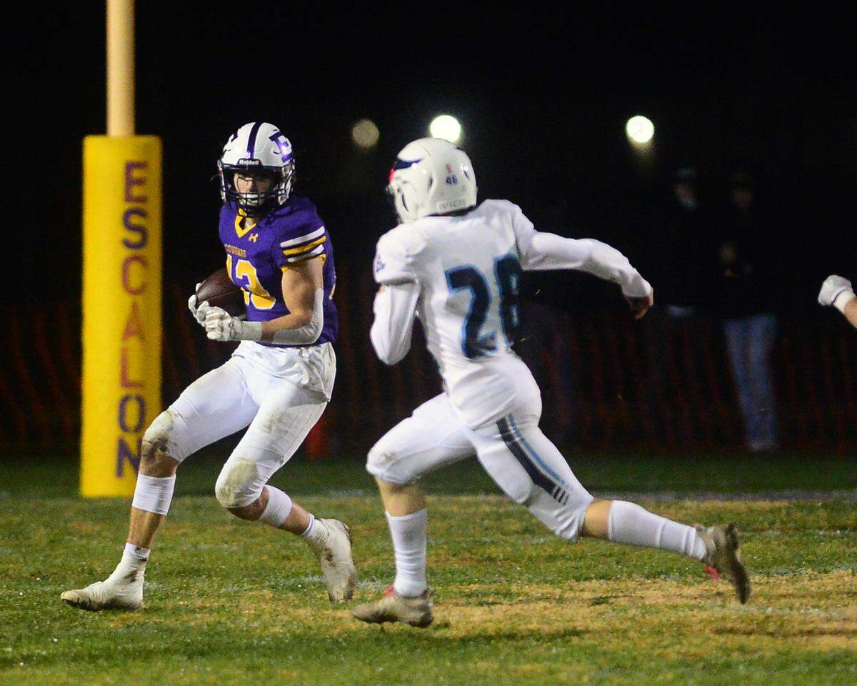 Escalon receiver Owen Nash (13) cuts back to get past a defender during the 2022 CIF NorCal Division 4-AA Bowl Game between Escalon High School and Pleasant Valley High School at Escalon High School in Escalon CA on Dec. 2, 2022. Escalon won the game 42-20.