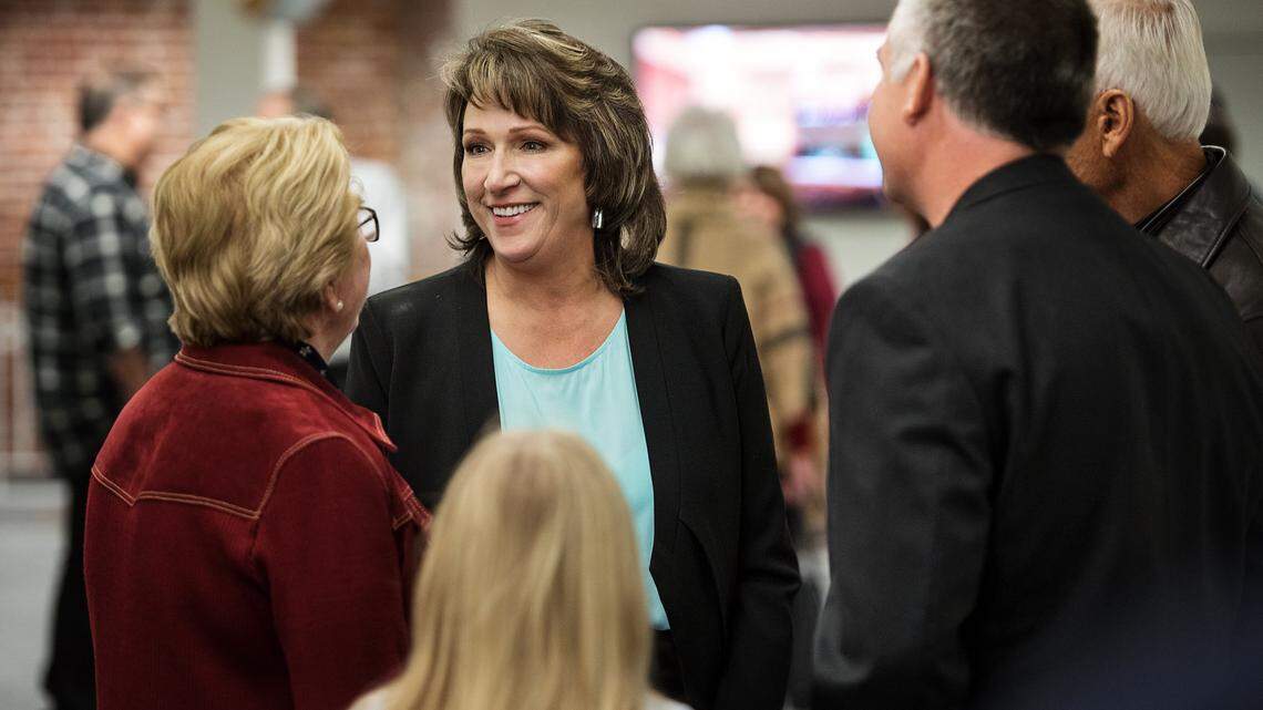 Amy Bublak speaks to resident before being sworn-in as the first female mayor at the Turlock City Council meeting in Turlock, Calif., Tuesday, Dec. 11, 2018.