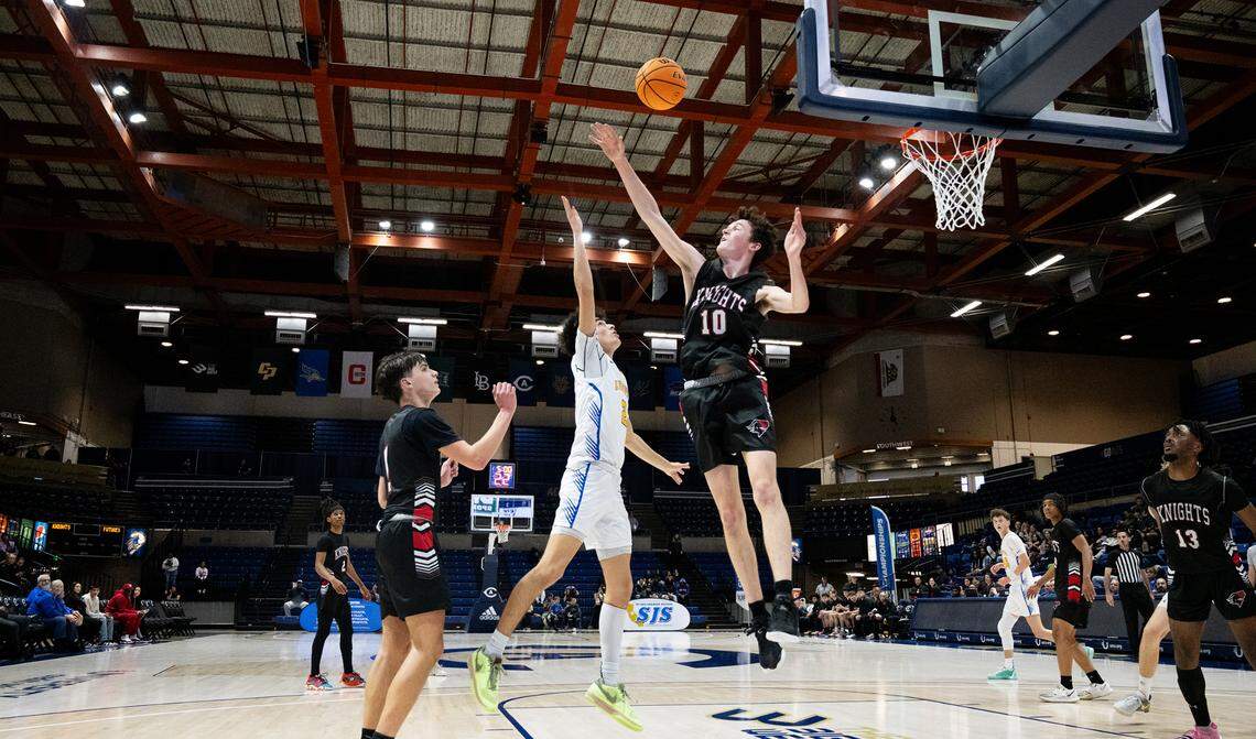 Ripon Christian’s Luke Crivello floats the ball over Futures’ Ivan Blyshchyk for the basket during the Sac-Joaquin Section Division V championship game at UC Davis in Davis, Calif., Friday, Feb. 23, 2024.