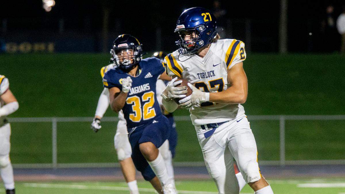 Brayden Green, 27, of Turlock High works his way upfield with Avyn Redoble, 32, of Gregori High closing in on him Thursday Sept. 28, 2023.
