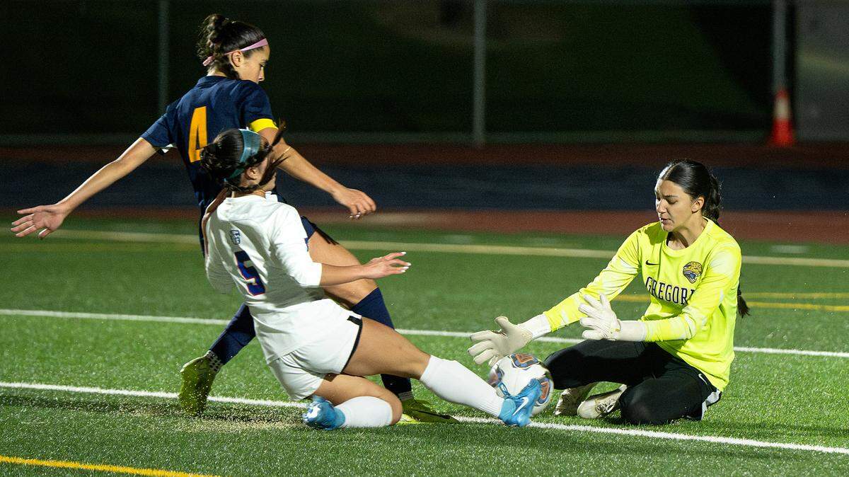 Gregori goalie Jocelyn Malagon stops a shot on goal by Folsom’s Kiana Arbis during the Sac-Joaquin Section Division I match at Gregori High School in Modesto, Wednesday, February, 26, 2025.