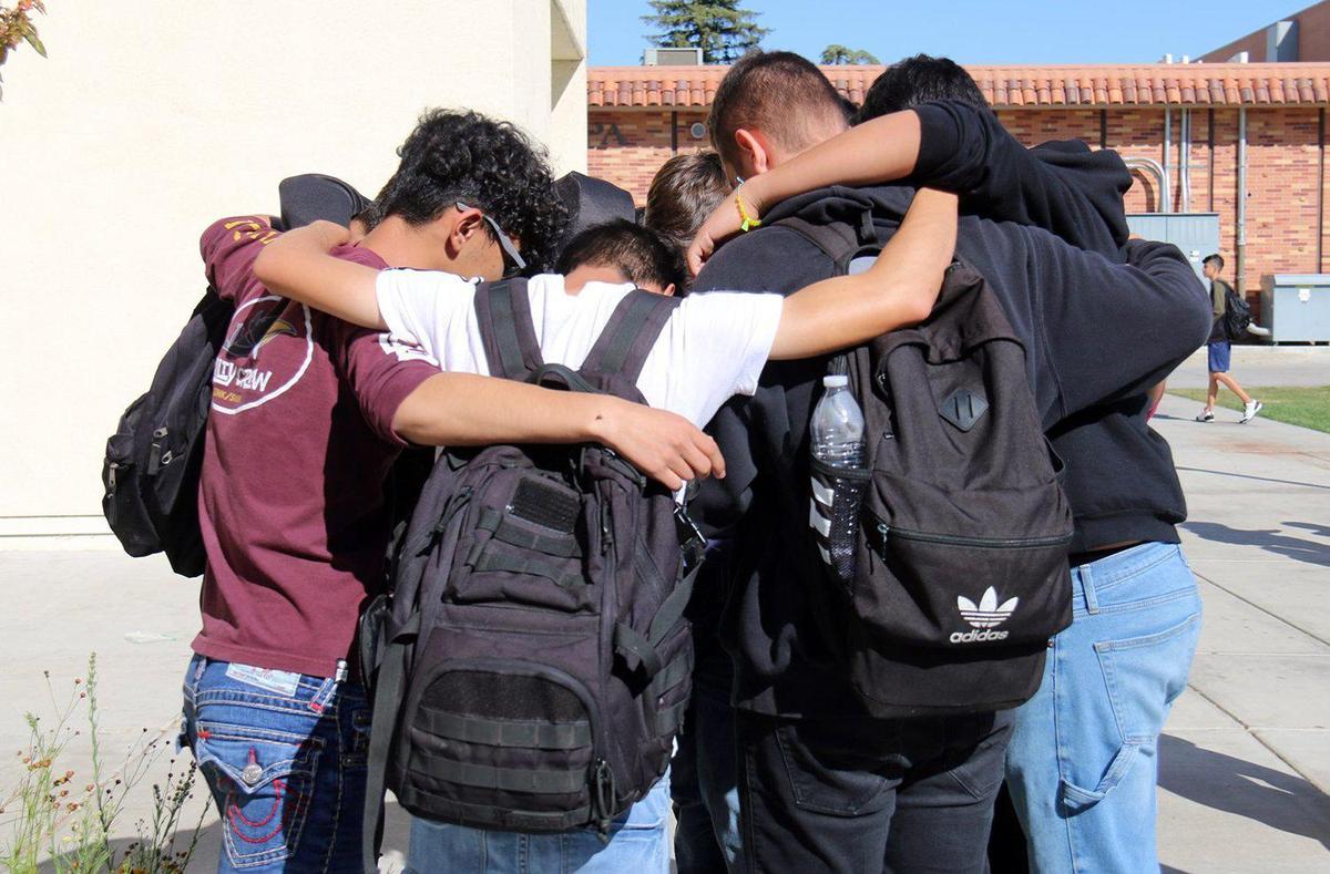 Students at Turlock high school embrace as they remember Estevan Nuno, a high school sophomore that passed away Monday evening October 21, 2019 after a medical incident at Crane Park.