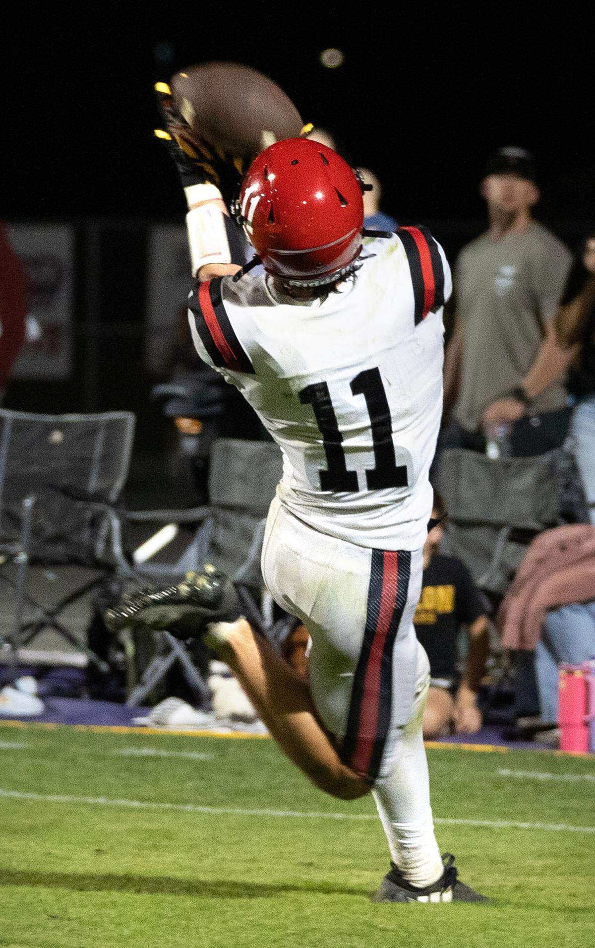 Woodland Christian’s Carter Lang catches a touchdown pass during a non-league game against Escalon High at Escalon High School on Thursday, Oct. 10, 2024.