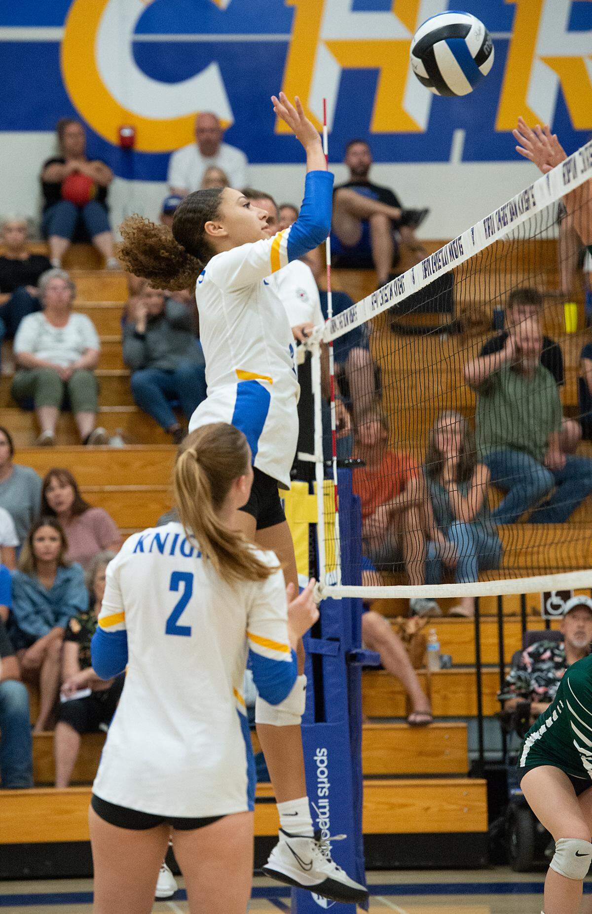 Ripon Christian’s Sydney Hoffman floats a the ball over the net during the Southern League game with Mariposa County in Ripon, Calif., Thursday, Oct. 13, 2022. Ripon Christian won the match 3-0.