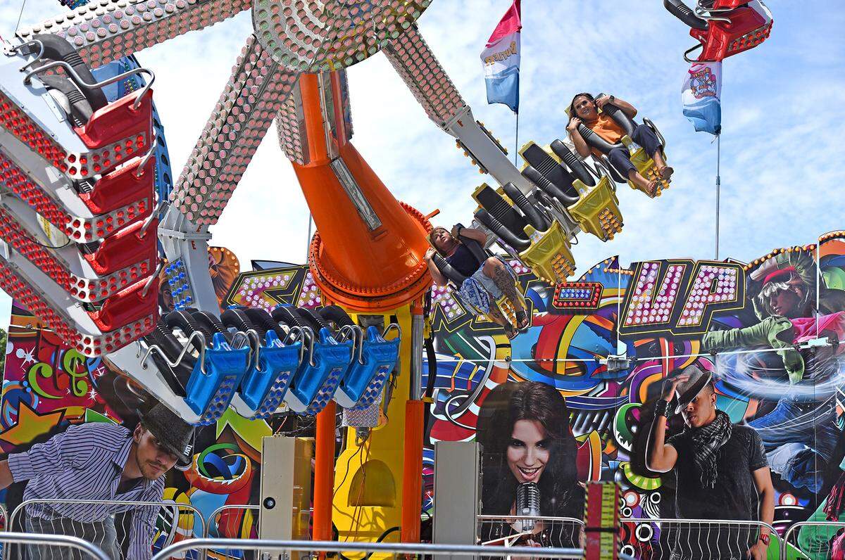 People enjoy themselves on the Shake-Up ride Thursday July 12, 2018 on the midway at the Stanislaus County Fair in Turlock, Calif. 