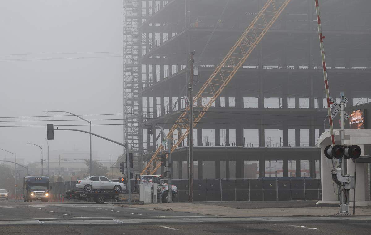 Fog settles in downtown Modesto, Calif., Sunday, Dec. 25, 2022.