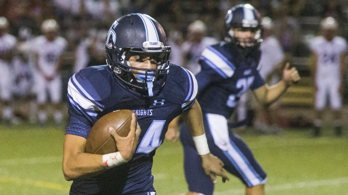 Jordan Wilson, 24, breaks around the corner and up the sideline looking to gain yardage. Downey High took on East Union Friday Aug. 17, 2018.