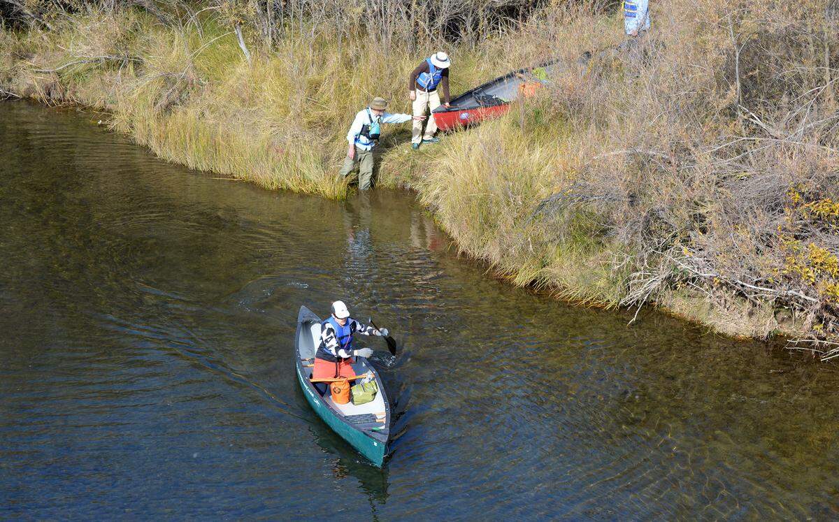 Canoeists set out to observe salmon spawning on the Tuolumne River near La Grange CA on Nov. 12, 2022.