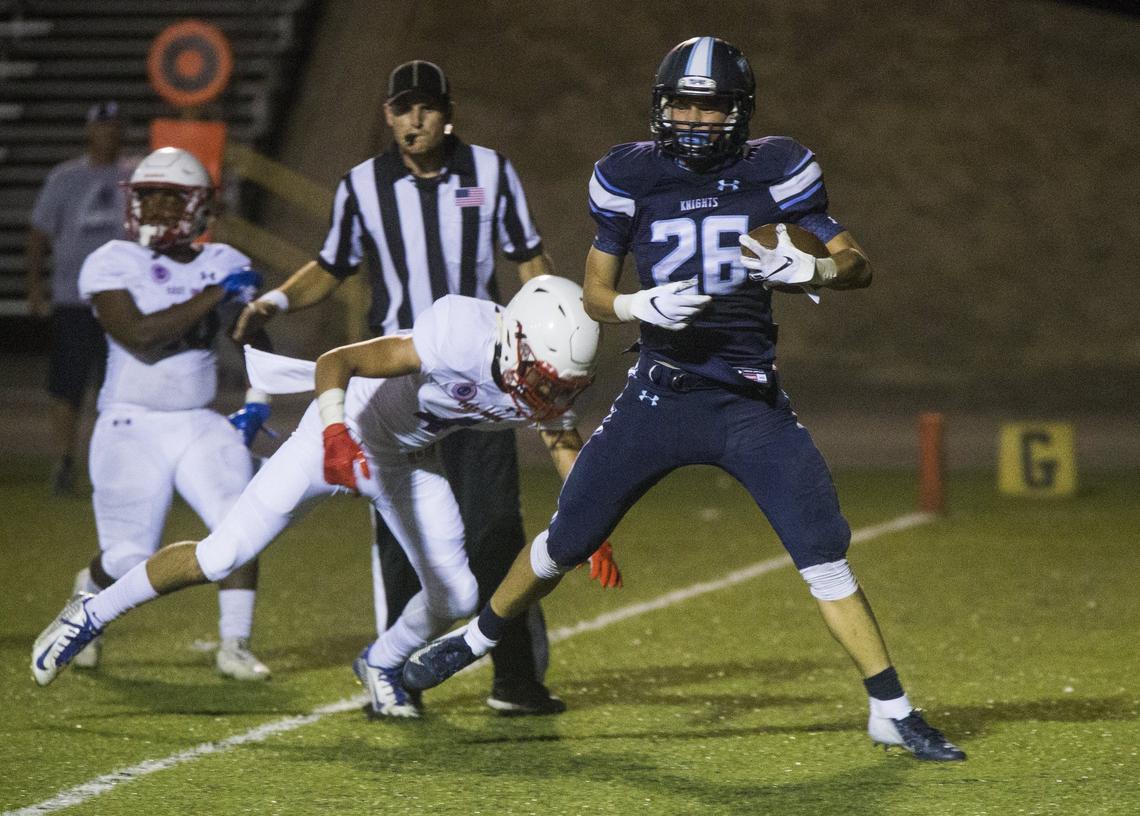 Anderson Grover, 26, takes a big step into the end zone for a touchdown against East Union. Downey High took on East Union Friday Aug. 17, 2018.