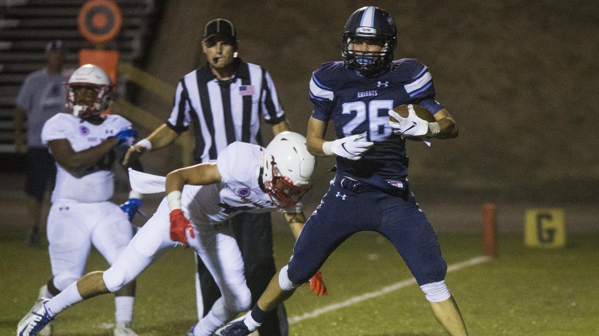 Anderson Grover, 26, takes a big step into the end zone for a touchdown against East Union. Downey High took on East Union Friday Aug. 17, 2018.