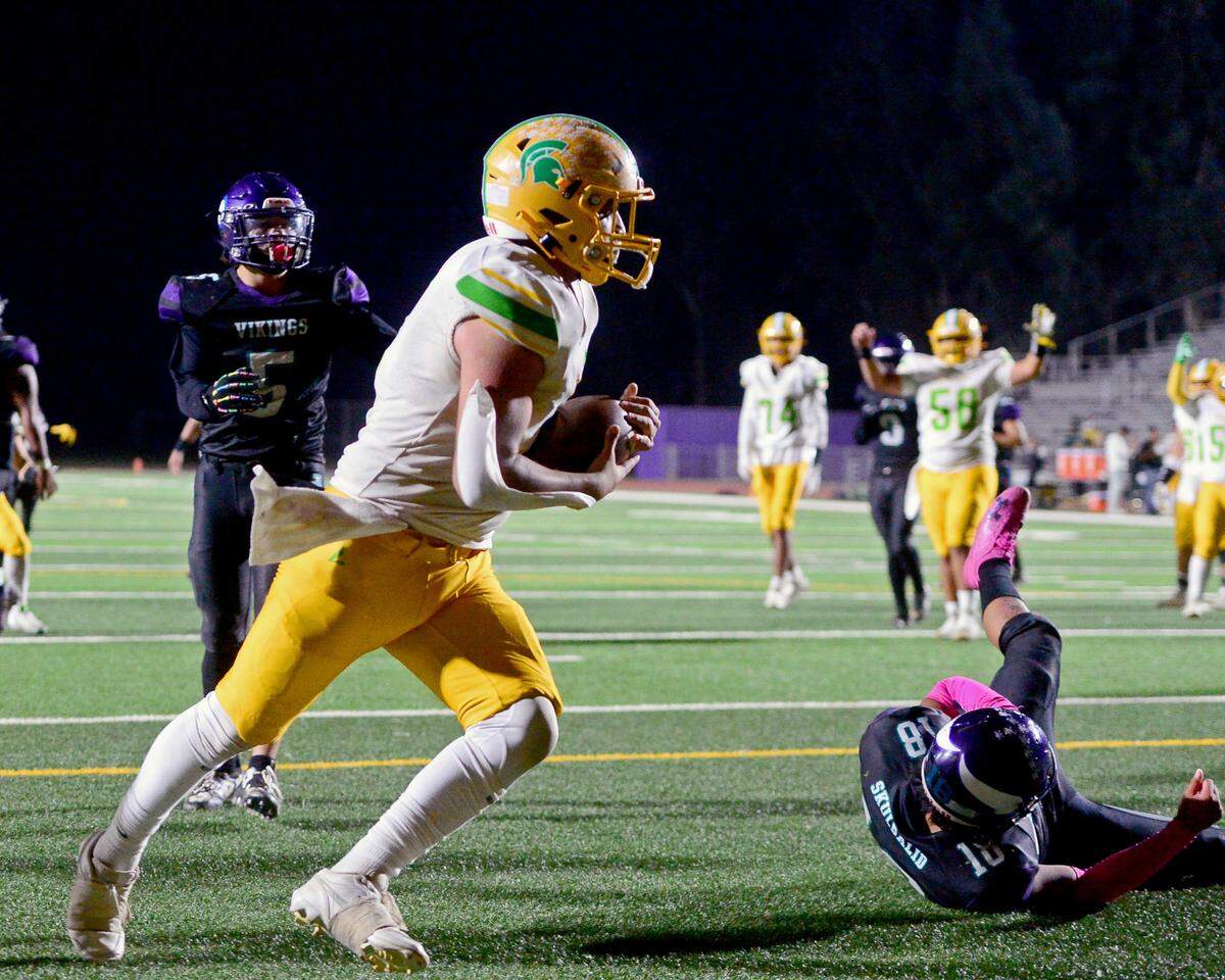 Daviss Chris Munoz (5) catches a touchdown during a game between Johansen and Davis at Johansen High School in Modesto California on November 1, 2024.