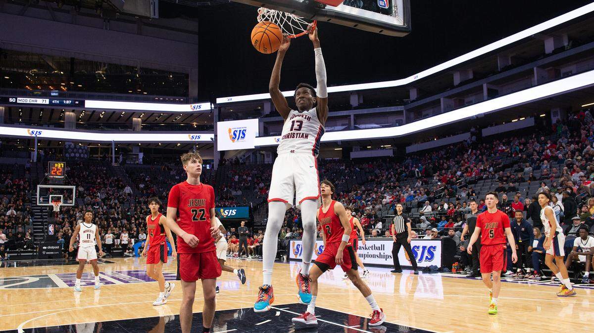Modesto Christian’s Prince Oseya dunks the ball during the Sac-Joaquin Section Division I championship game with Jesuit at Golden 1 Center in Sacramento, Calif., Saturday, Feb. 25, 2023.