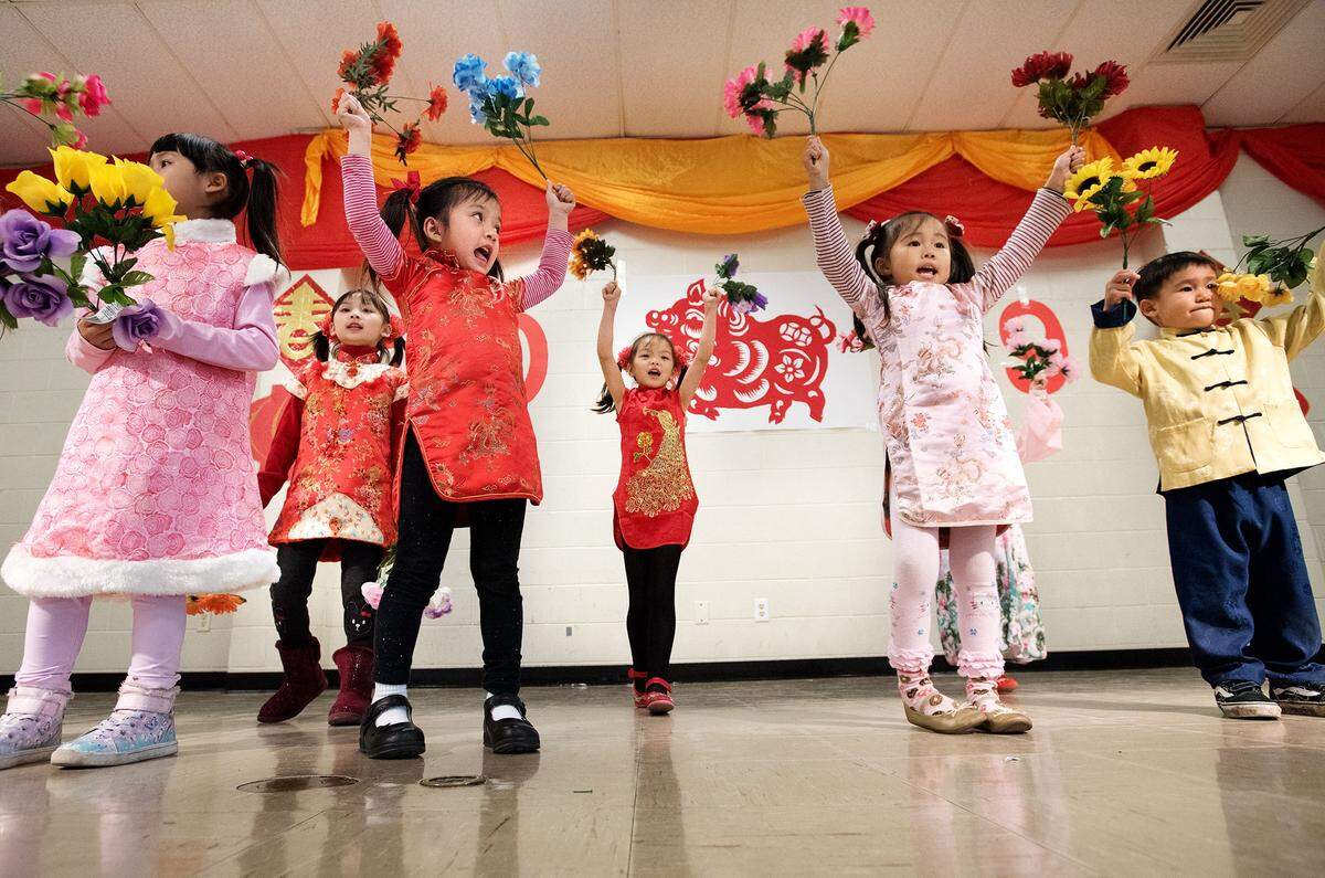 Children from the Stanislaus Chinese Culture Society dance to the Happy New Year song during a celebration of Chinese New Year at the Modesto Senior Center in Modesto, Calif., Saturday, Feb. 2, 2019.