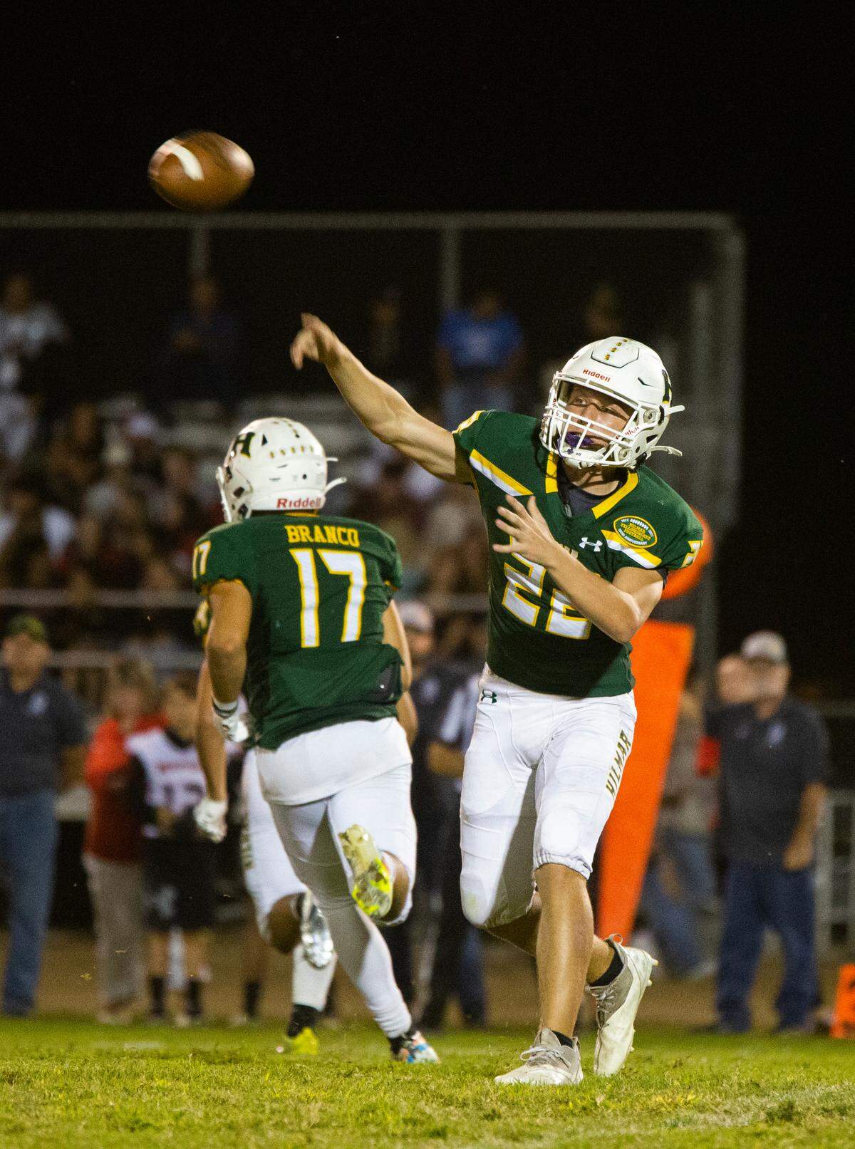 Caden Bailey, 22, of Hilmar High throws a pass up field. Ripon vs Hilmar at Hilmar Sept. 23, 2022.