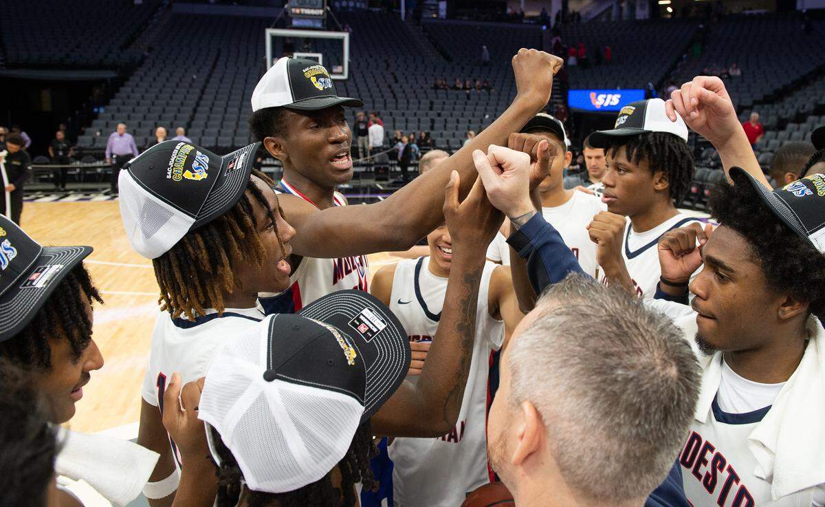Modesto Christian players celebrate their victory over Jesuit during the Sac-Joaquin Section Division I championship game at Golden 1 Center in Sacramento, Calif., Saturday, Feb. 25, 2023. Modesto Christian won 79-53.