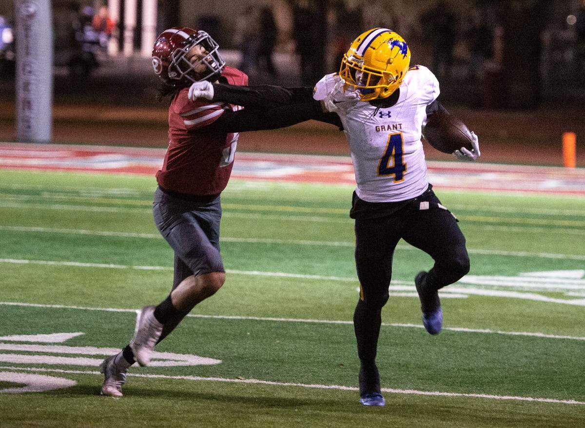 Grant’s Semaj Mafu-Hart fights off Patterson’s Leo Refil during a Sac-Joaquin Section Division III semifinal in Patterson, Calif., Friday, Nov. 18, 2022. Grant won 80-44.
