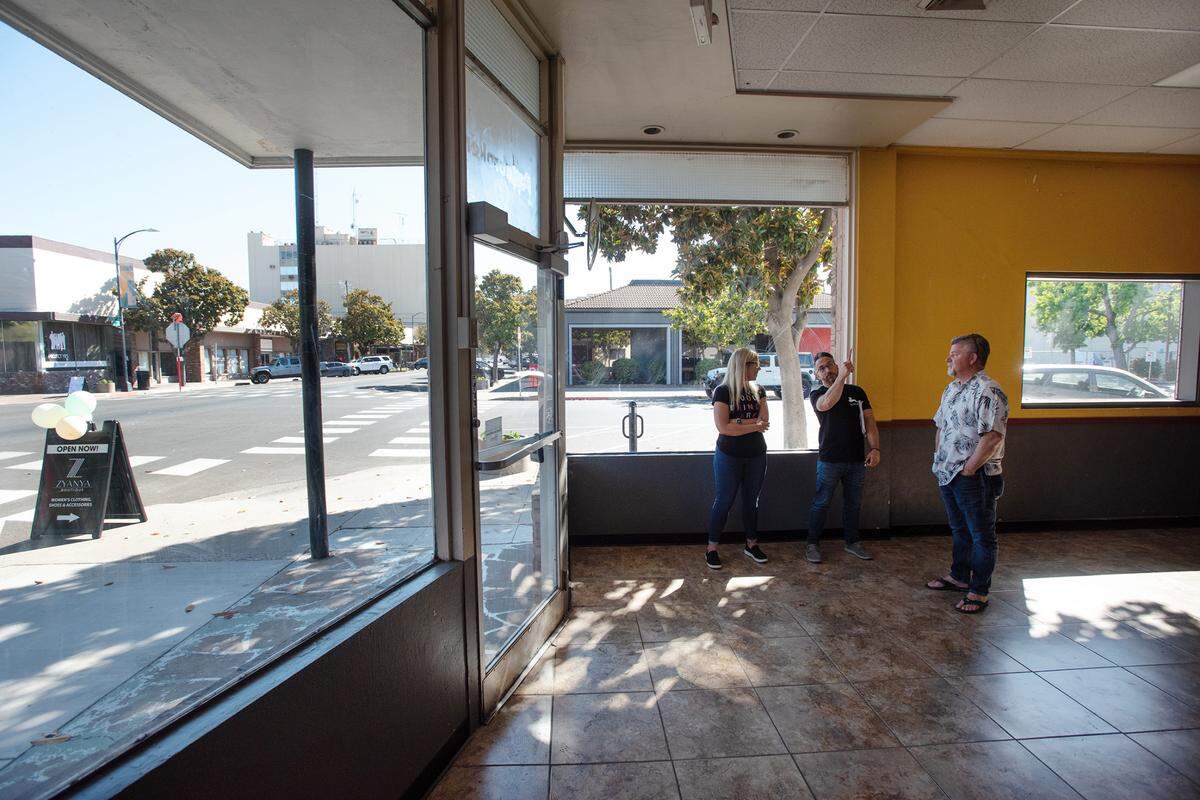 State Theatre board members Sam Pierstorff, Jessica Godden and Brian Gini in the theater’s new “community” space on the corner of 13th and J Streets in Modesto, Calif., on Friday, May 13, 2022.