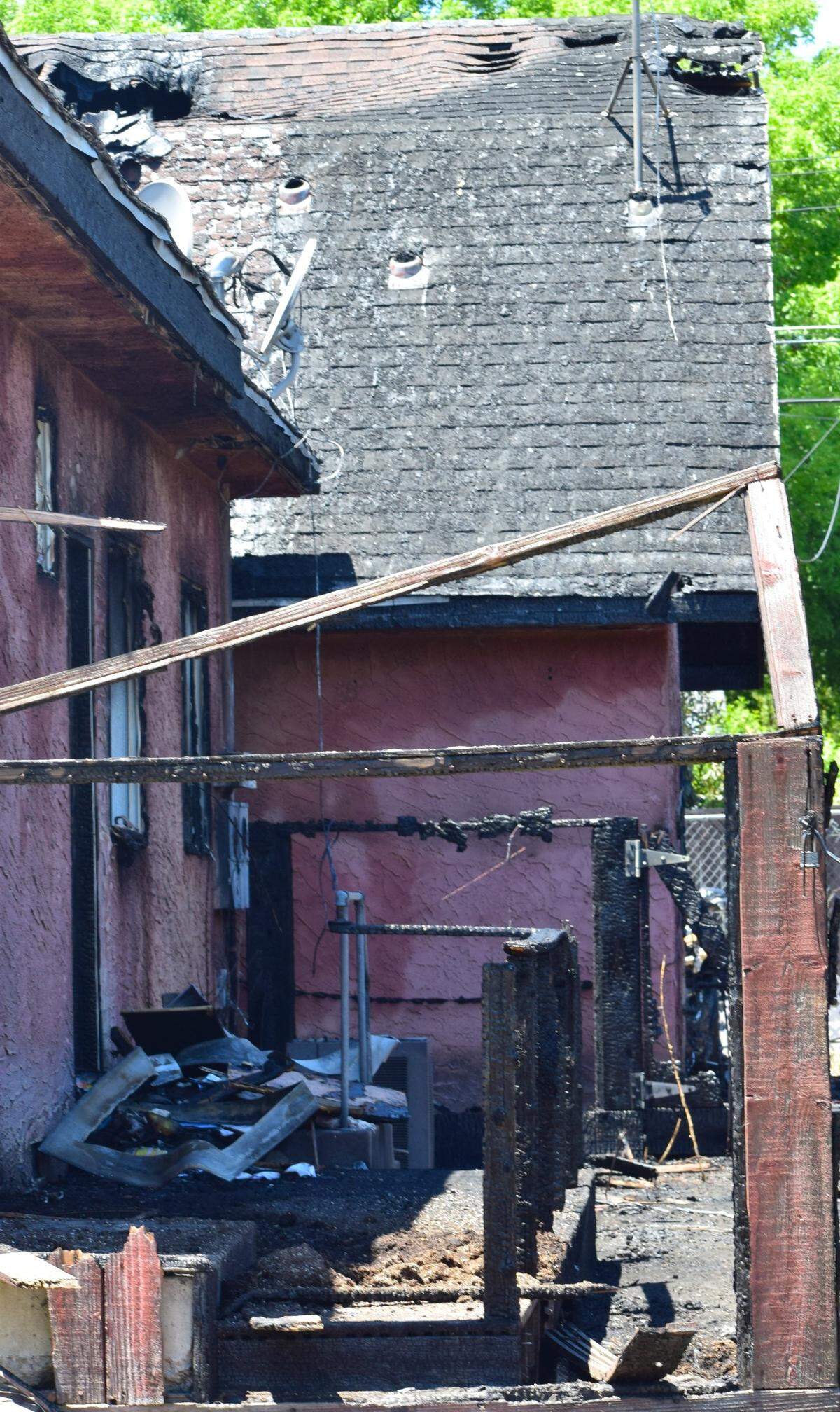 The remnants of a home under construction that caught fire in the early morning hours of Friday, July 5, 2024. The flames damaged two adjacent homes, displacing nine people.