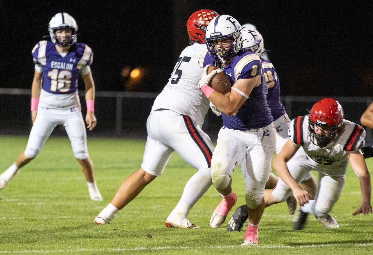 Escalon’s Ben Gonzalez runs the ball during a non-league game against Woodland Christian at Escalon High School on Thursday, Oct. 10, 2024.