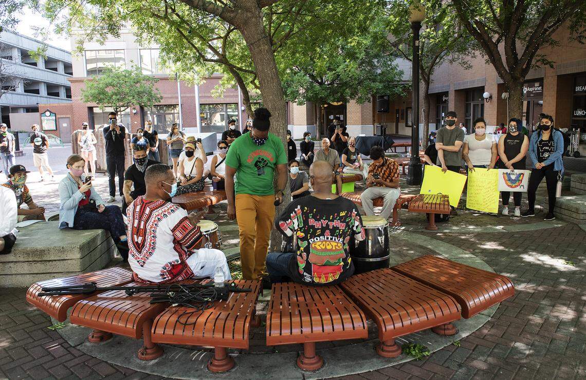 Modesto residents attend a gathering organized by the community organizers ActionsOver# at 10th Street Place in Modesto, Calif., on Saturday, June 6, 2020.