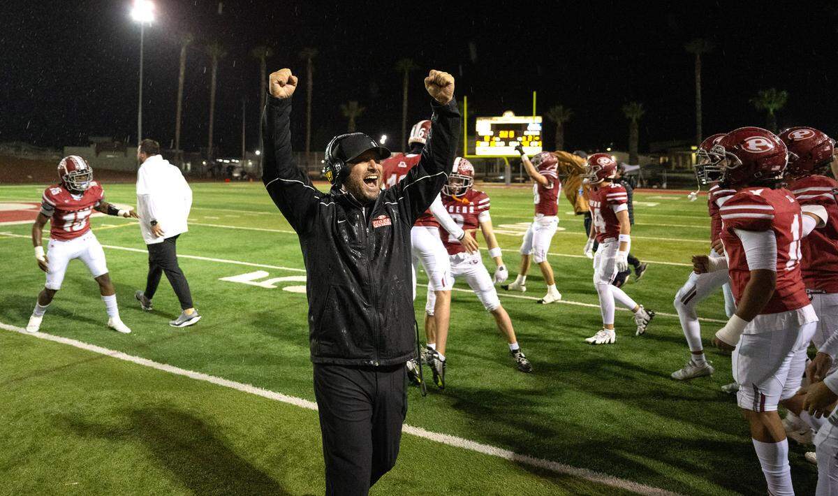 Patterson coach Rob Cozart celebrates the 21-12 victory over Sacramento in the Sac-Joaquin Section Division IV semifinal game at Patterson High School in Patterson, Friday, Nov. 22, 2024.