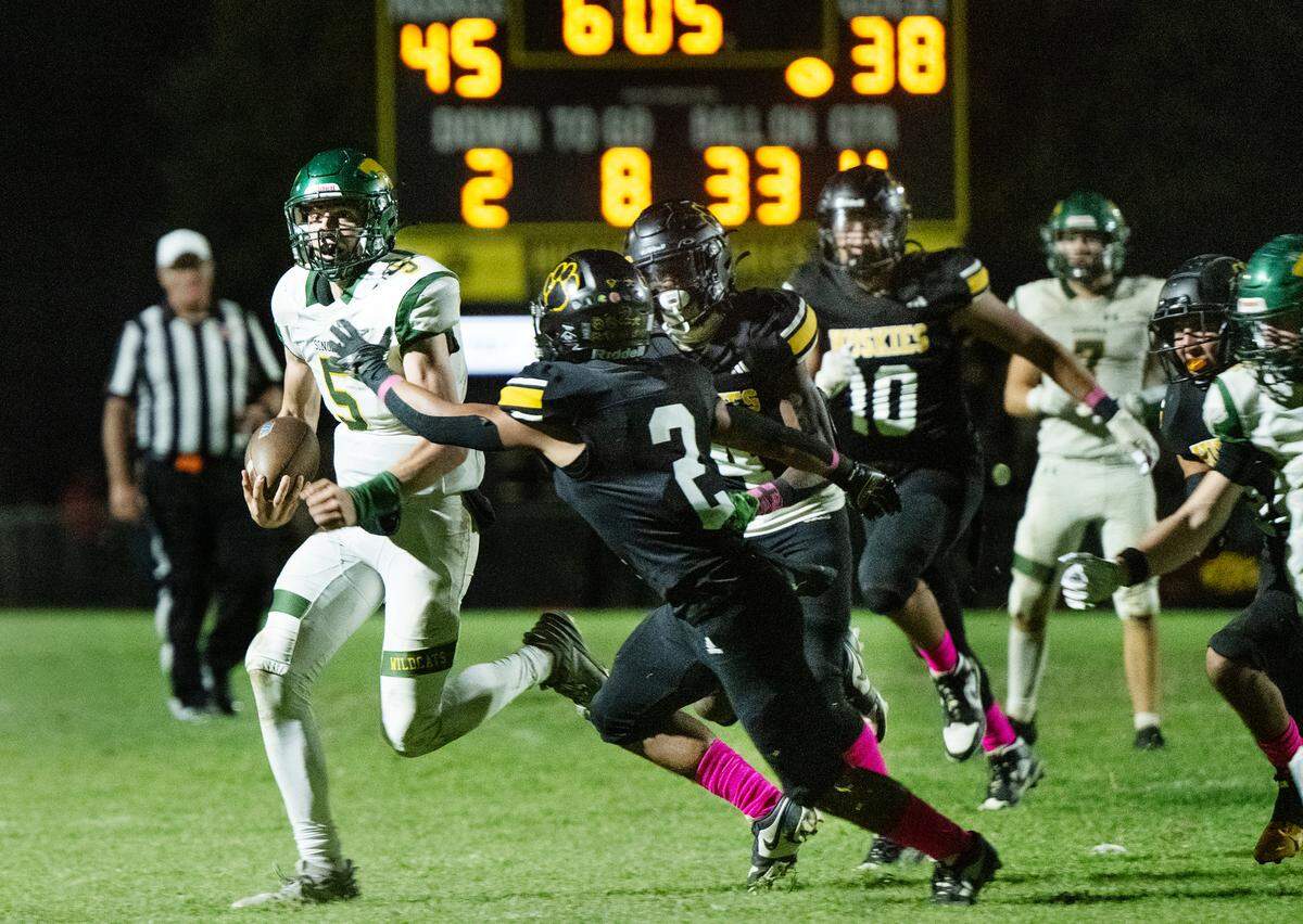 Sonora quarterback Eli Ingalls breaks out on a touchdown run during the Trans Valley League game with Sonora in Hughson, Friday, Oct. 11, 2024. Hughson won the game 52-51.