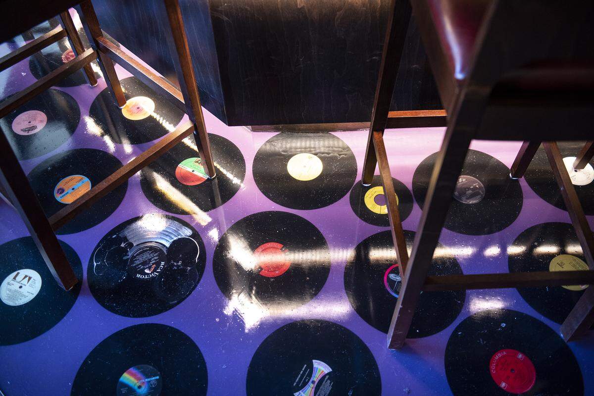 Vintage vinyl records are embedded into the bar floor at Lo-Fi craft cocktail bar in Modesto, Calif., Wednesday, July 31, 2019.