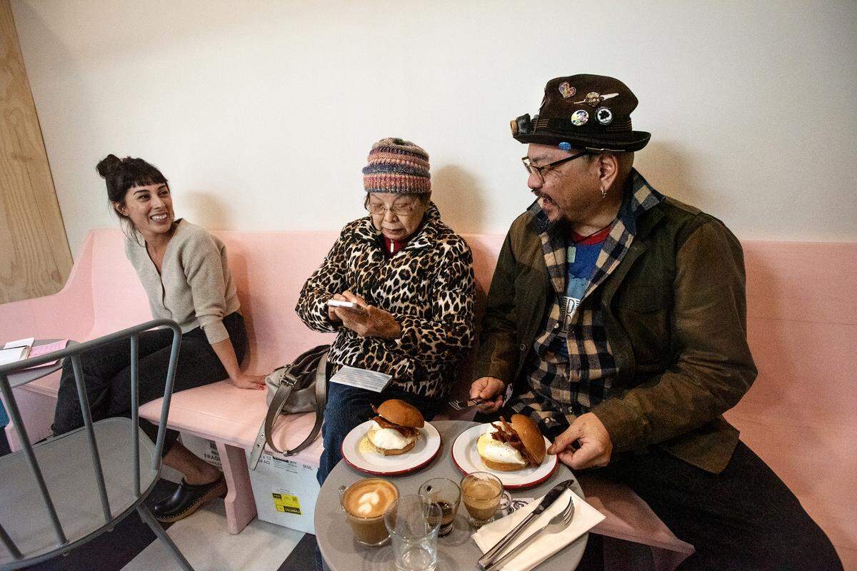 Lucille co-owner Marissa Smith, left, talks with customers Lake Wong and his mother Donna during breakfast in Modesto, Calif., Friday, Feb. 3, 2023.